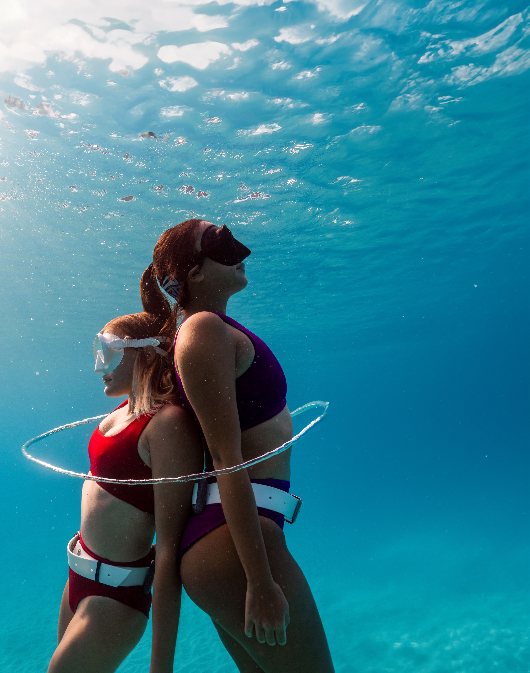 ocean galz diving underwater with mask